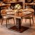 Square Wooden Dining Table with Cane Shelf and Central Pedestal Manufacturers, Suppliers in Delhi