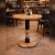 Round Wooden Table with Dual Tone Turned Base for Bistro Seating Manufacturers, Suppliers in Delhi